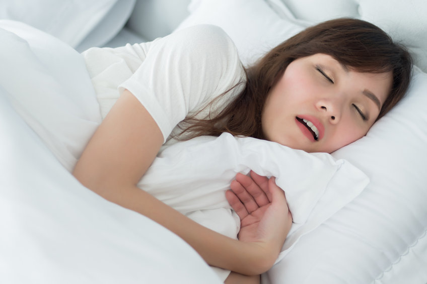 An asian woman sleeping