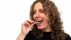 How Does Invisalign Work woman holding invisible