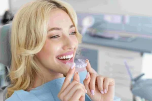 attractive woman holding Invisalign