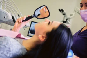 after Jaw Surgery female sits in a dentist chair