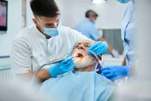 dentist with old man for Oral Surgery